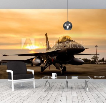 Picture of F16 falcon fighter jet on sunset background 